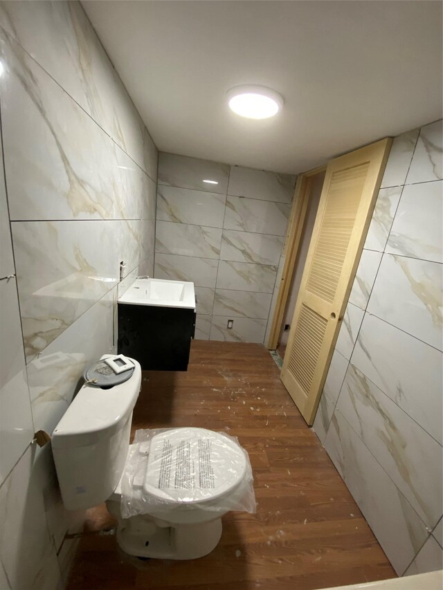 57 Chestnut St, Beach Lake, NY 13865 - bathroom featuring tile walls, wood finished floors, and vanity