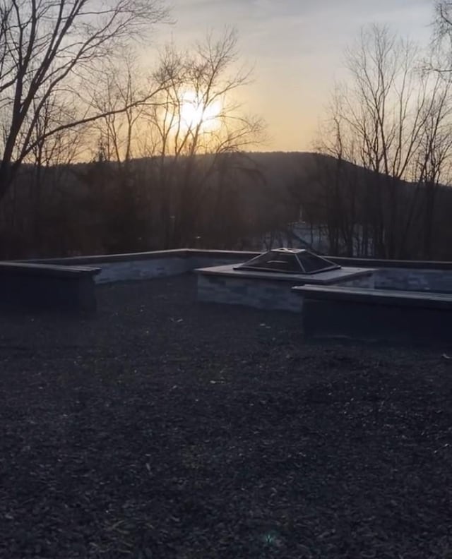 57 Chestnut St, Beach Lake, NY 13865 - view of parking at dusk