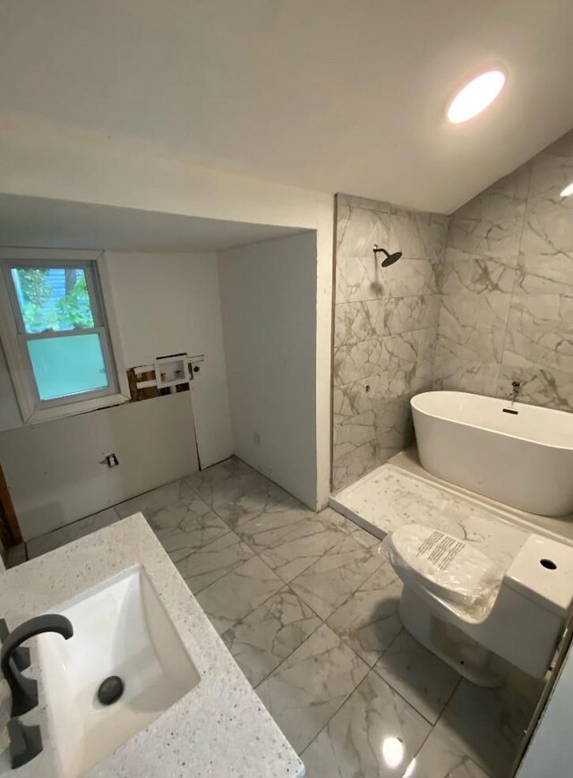 57 Chestnut St, Beach Lake, NY 13865 - bathroom with marble look tile flooring, a soaking tub, and vanity