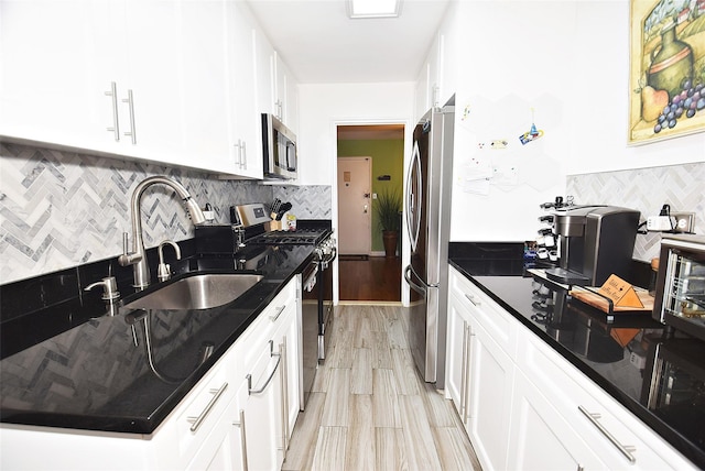 18-70 211th St Unit 5K, Bayside, NY 11360 - kitchen with stainless steel appliances, tasteful backsplash, white cabinetry, dark stone countertops, and light wood-type flooring