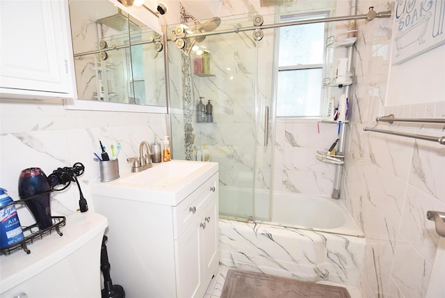 18-70 211th St Unit 5K, Bayside, NY 11360 - full bathroom with shower / bath combination with glass door, vanity, and tile walls