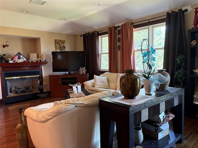 4218 217th St, Bayside, NY 11361 - living room with wood finished floors, a glass covered fireplace, and recessed lighting