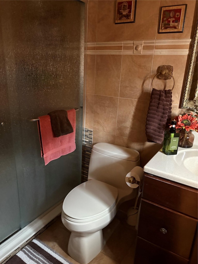 4218 217th St, Bayside, NY 11361 - bathroom featuring tile walls, vanity, and a shower with door
