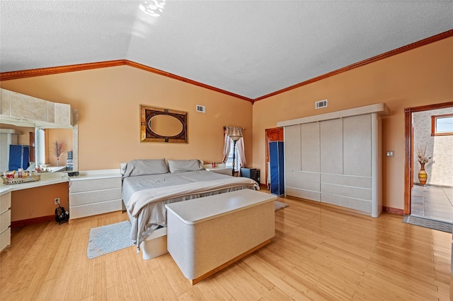 3362 Colony Dr, Baldwin Harbor, NY 11510 - bedroom with vaulted ceiling, crown molding, a textured ceiling, and light wood-style floors