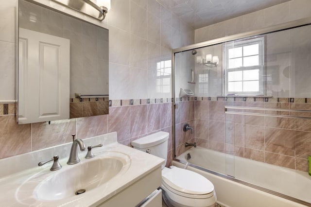18 Loring Rd, Levittown, NY 11756 - full bath featuring tile walls, vanity, shower / bath combination with glass door, and decorative backsplash