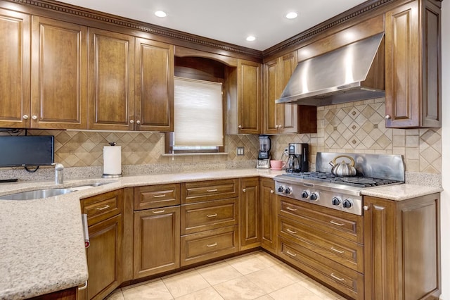 18 Loring Rd, Levittown, NY 11756 - kitchen featuring wall chimney exhaust hood, stainless steel gas stovetop, decorative backsplash, and light tile patterned flooring