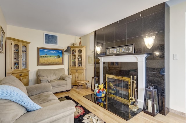 18 Loring Rd, Levittown, NY 11756 - living room featuring wood finished floors and a tiled fireplace