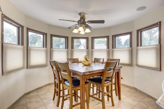 18 Loring Rd, Levittown, NY 11756 - dining area featuring healthy amount of natural light, light tile patterned floors, and a ceiling fan