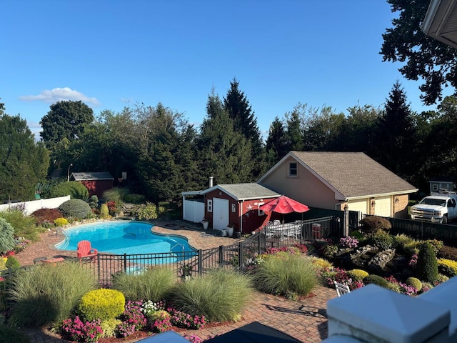 18 Loring Rd, Levittown, NY 11756 - view of swimming pool featuring a storage shed