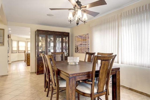 18 Loring Rd, Levittown, NY 11756 - dining area with light tile patterned floors and ceiling fan