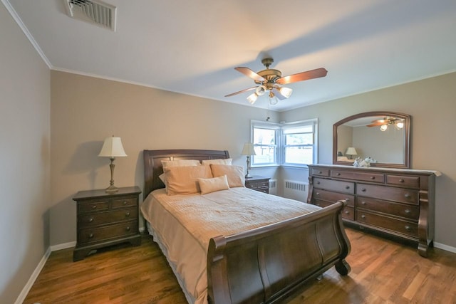 15115 25th Ave, Whitestone, NY 11357 - bedroom featuring radiator, dark wood finished floors, ornamental molding, and ceiling fan