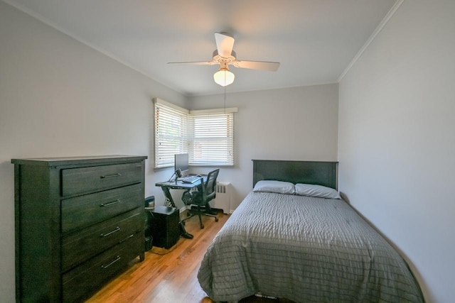 15115 25th Ave, Whitestone, NY 11357 - bedroom featuring radiator, light wood-type flooring, ornamental molding, and ceiling fan