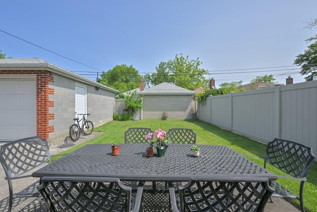 15115 25th Ave, Whitestone, NY 11357 - fenced backyard with outdoor dining area and an outdoor structure