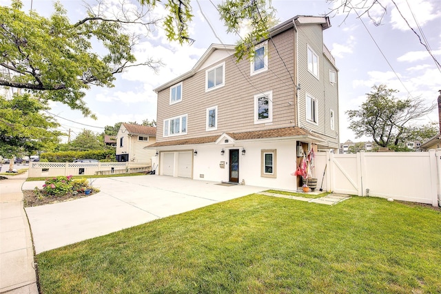 615 Pearl St, Oceanside, NY 11572 - back of house featuring driveway, a garage, a gate, and stucco siding