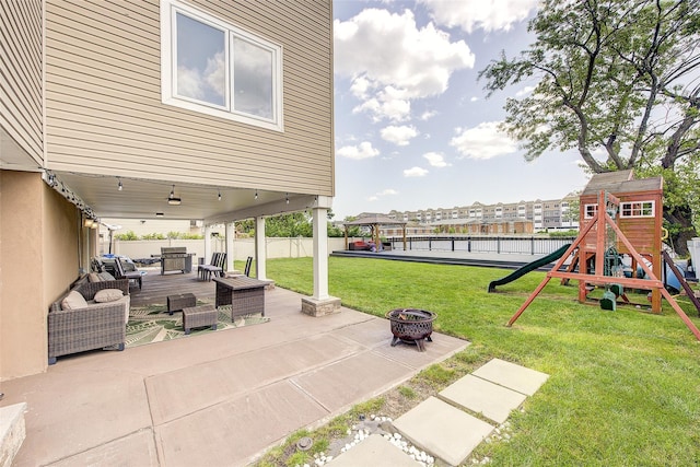 615 Pearl St, Oceanside, NY 11572 - view of patio / terrace featuring an outdoor living space with a fire pit and a playground