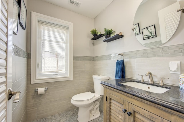 615 Pearl St, Oceanside, NY 11572 - half bath with tile walls, plenty of natural light, vanity, and wainscoting