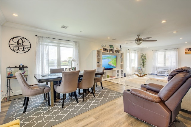 615 Pearl St, Oceanside, NY 11572 - dining area with ornamental molding, wood finished floors, a ceiling fan, and recessed lighting