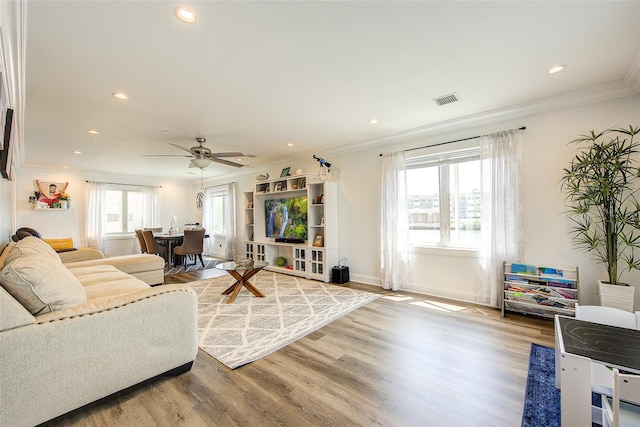 615 Pearl St, Oceanside, NY 11572 - living room with ornamental molding, wood finished floors, recessed lighting, and a ceiling fan
