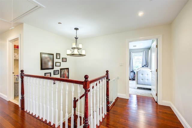 615 Pearl St, Oceanside, NY 11572 - hallway with attic access, an upstairs landing, dark wood-style floors, and recessed lighting