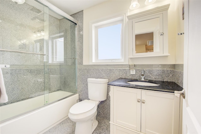 615 Pearl St, Oceanside, NY 11572 - full bath featuring shower / bath combination with glass door, vanity, and tile walls