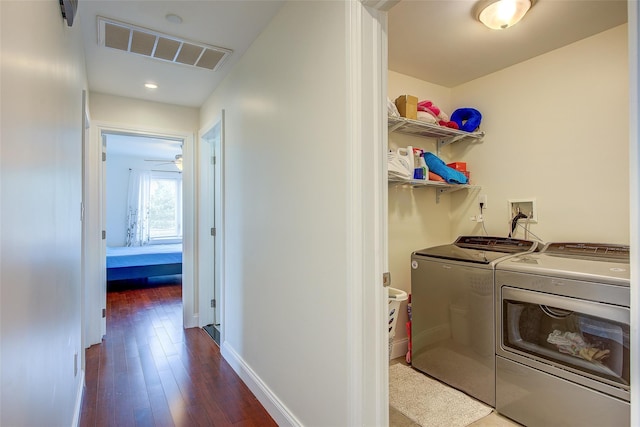 615 Pearl St, Oceanside, NY 11572 - laundry area with washing machine and clothes dryer and wood-type flooring