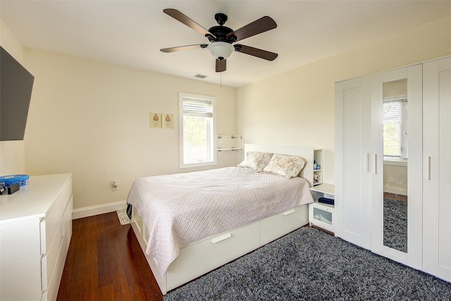 615 Pearl St, Oceanside, NY 11572 - bedroom with dark wood-style flooring and a ceiling fan