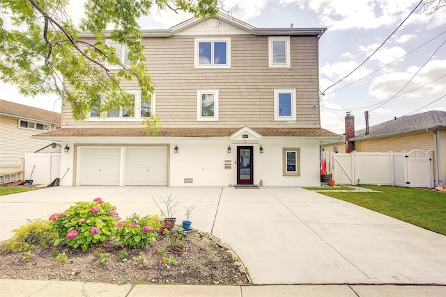 615 Pearl St, Oceanside, NY 11572 - view of front of home featuring a gate, driveway, an attached garage, and stucco siding