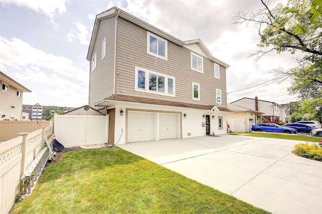 615 Pearl St, Oceanside, NY 11572 - view of front of house featuring a garage and driveway