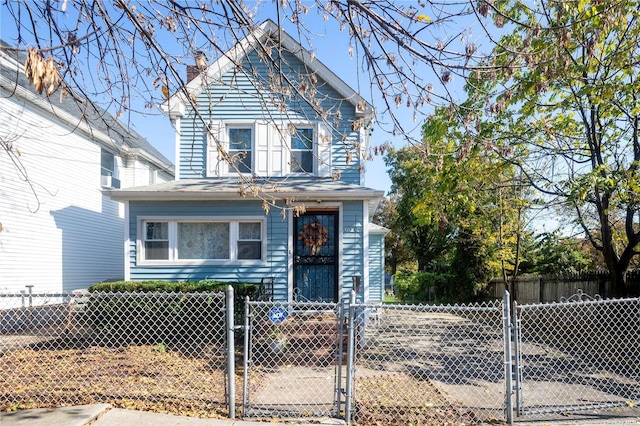 60-09 170th St, Flushing, NY 11365 - traditional-style house with a gate, a fenced front yard, and a chimney
