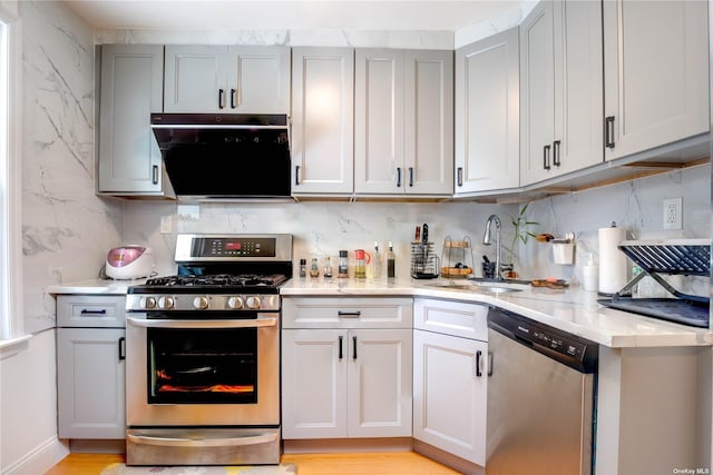 60-09 170th St, Flushing, NY 11365 - kitchen with appliances with stainless steel finishes, backsplash, and light stone countertops