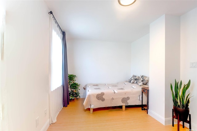 60-09 170th St, Flushing, NY 11365 - bedroom featuring wood finished floors and baseboards