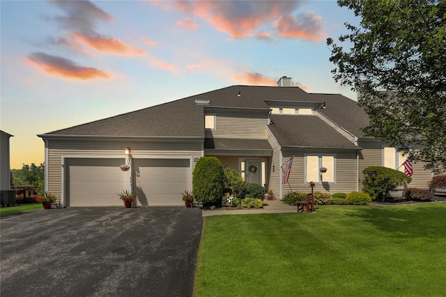 182 Fairway Dr, Carmel, NY 10512 - view of front of house with driveway, a garage, a front lawn, and a shingled roof