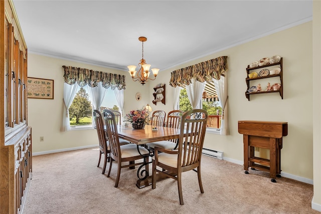 182 Fairway Dr, Carmel, NY 10512 - dining area with a chandelier, ornamental molding, light carpet, and a baseboard heating unit