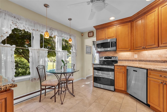 182 Fairway Dr, Carmel, NY 10512 - kitchen with appliances with stainless steel finishes, tasteful backsplash, brown cabinetry, and light tile patterned floors