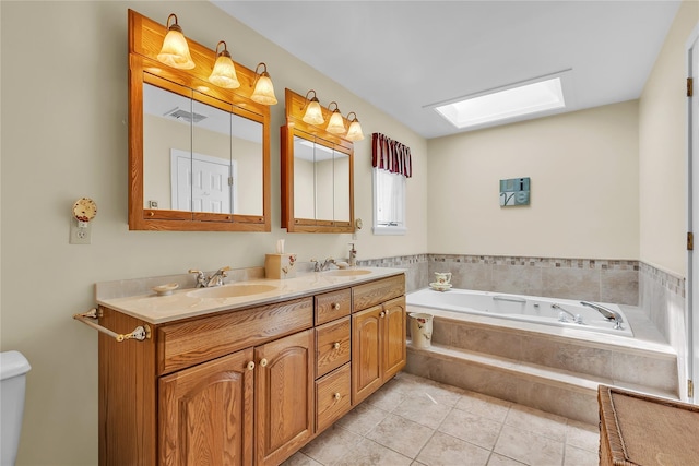 182 Fairway Dr, Carmel, NY 10512 - bathroom with a skylight, double vanity, a garden tub, and tile patterned floors