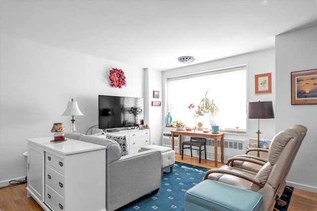 700 Shore Rd Unit 5Ee, Long Beach, NY 11561 - living area featuring wood finished floors and radiator heating unit