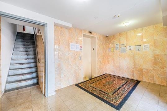 112-26 38th Ave Unit 4A, Corona, NY 11368 - corridor with elevator, stairway, and tile patterned flooring