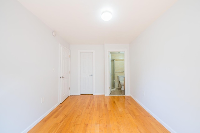 112-26 38th Ave Unit 4A, Corona, NY 11368 - empty room with light wood-style flooring and a smoke detector