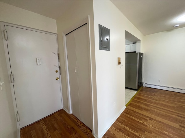 4260 Colden St Unit 4B, Flushing, NY 11355 - hall featuring electric panel, a baseboard heating unit, and light wood finished floors
