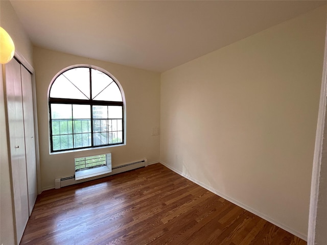 4260 Colden St Unit 4B, Flushing, NY 11355 - unfurnished room featuring dark wood finished floors and a baseboard heating unit