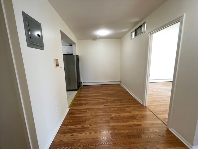 4260 Colden St Unit 4B, Flushing, NY 11355 - corridor with a baseboard radiator, electric panel, light wood finished floors, and baseboard heating