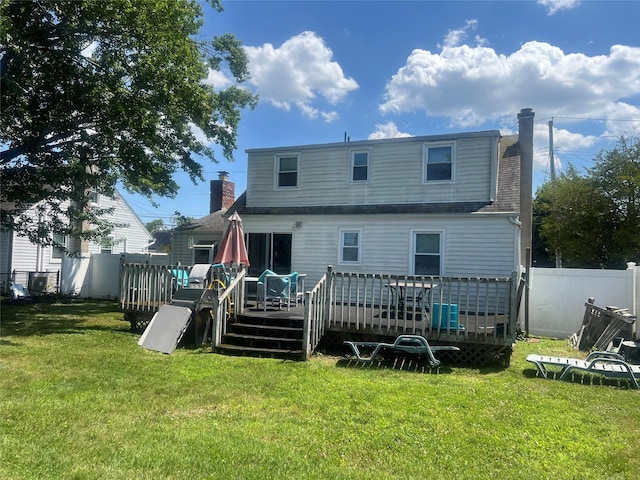 159 Van Buren St, West Babylon, NY 11704 - rear view of house featuring a deck, a chimney, and a shingled roof