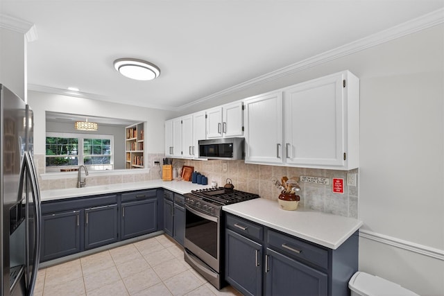 42 Prestwick Ct, Poughkeepsie, NY 12603 - kitchen featuring stainless steel appliances, white cabinetry, backsplash, and crown molding
