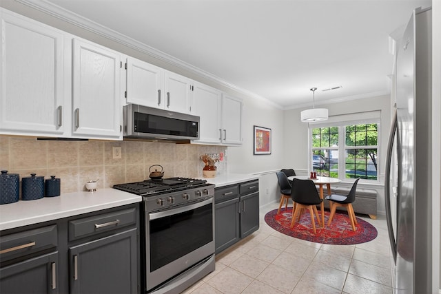42 Prestwick Ct, Poughkeepsie, NY 12603 - kitchen featuring stainless steel appliances, white cabinets, light countertops, tasteful backsplash, and ornamental molding