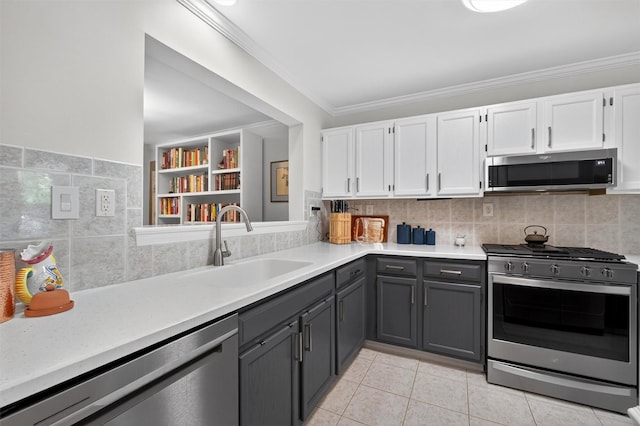 42 Prestwick Ct, Poughkeepsie, NY 12603 - kitchen with appliances with stainless steel finishes, gray cabinetry, white cabinetry, light countertops, and crown molding