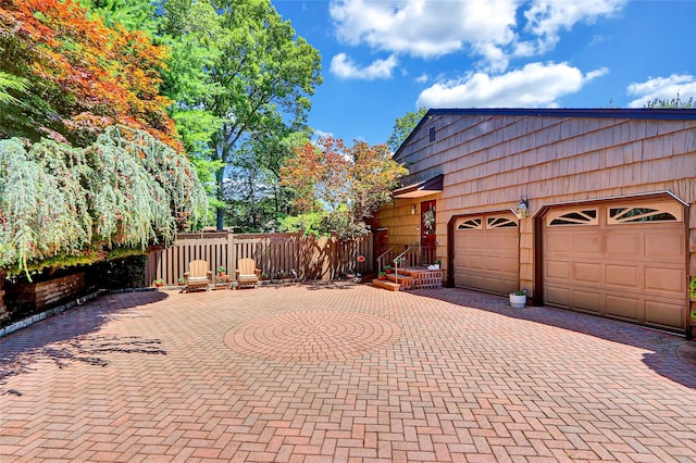 51 Glenridge Ave, Stony Brook, NY 11790 - view of property exterior featuring decorative driveway and a garage