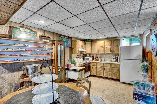 51 Glenridge Ave, Stony Brook, NY 11790 - kitchen featuring white appliances, light countertops, under cabinet range hood, wooden walls, and open shelves