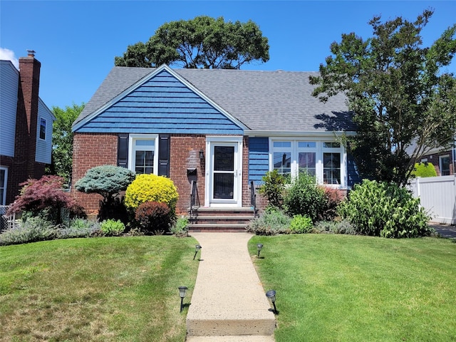 422 Saint Agnes Pl, Franklin Square, NY 11010 - bungalow-style home with brick siding and a shingled roof