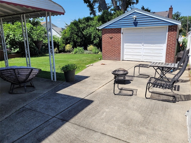 422 Saint Agnes Pl, Franklin Square, NY 11010 - view of patio featuring an outdoor fire pit, an outdoor structure, and a garage