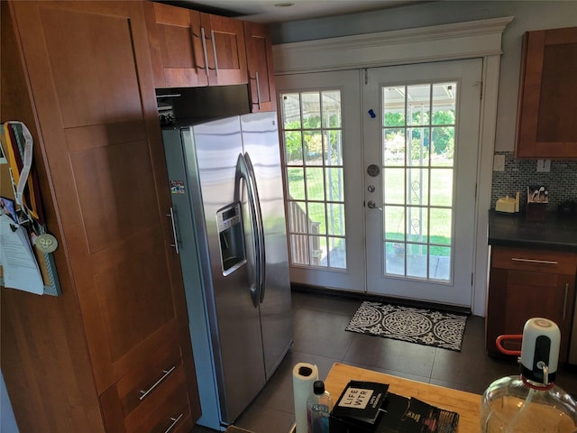 422 Saint Agnes Pl, Franklin Square, NY 11010 - kitchen with stainless steel fridge, french doors, dark countertops, backsplash, and brown cabinetry
